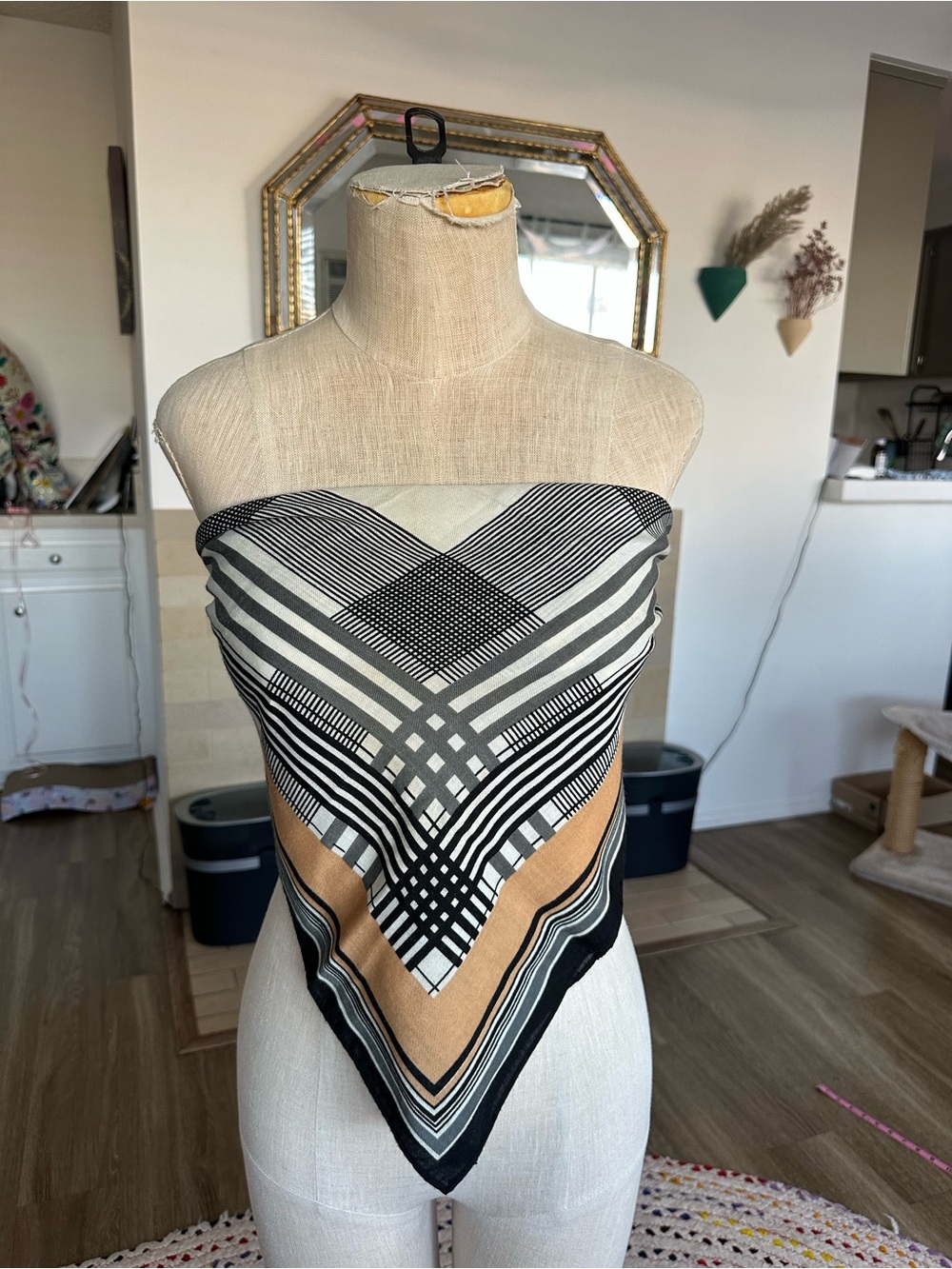 black, white, and tan geometric pattern scarf